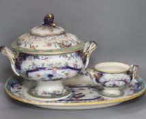 A mid 19th century Staffordshire pottery lidded soup tureen and cover (base cracked), a large meat