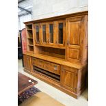 A large reproduction oak dresser with wine bottle storage, length 244cm, depth 60cm, height 201cm