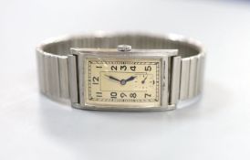 A gentleman's 1930's? stainless steel Omega manual wind rectangular dial wrist watch, on