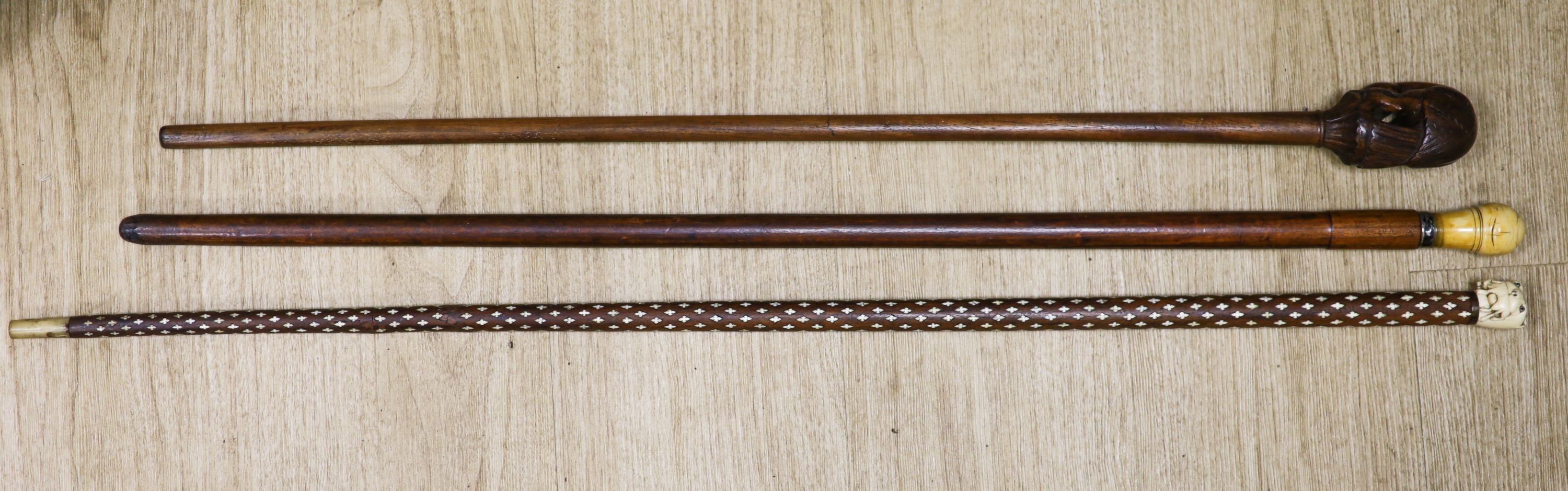 Three various walking canesIncluding two carved Ivory topped walking canes, one the cane in laid - Image 2 of 8