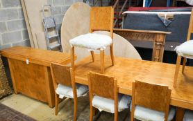 An Art Deco style bird's eye maple dining suite comprising table, six chairs and side cabinet, table