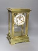 A 19th century French four-glass mantel clock with key and mercury filled pendulum bob34cm