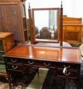 An Edwardian style inlaid mahogany dressing table with swing mirror, length 128cm, depth 54cm,