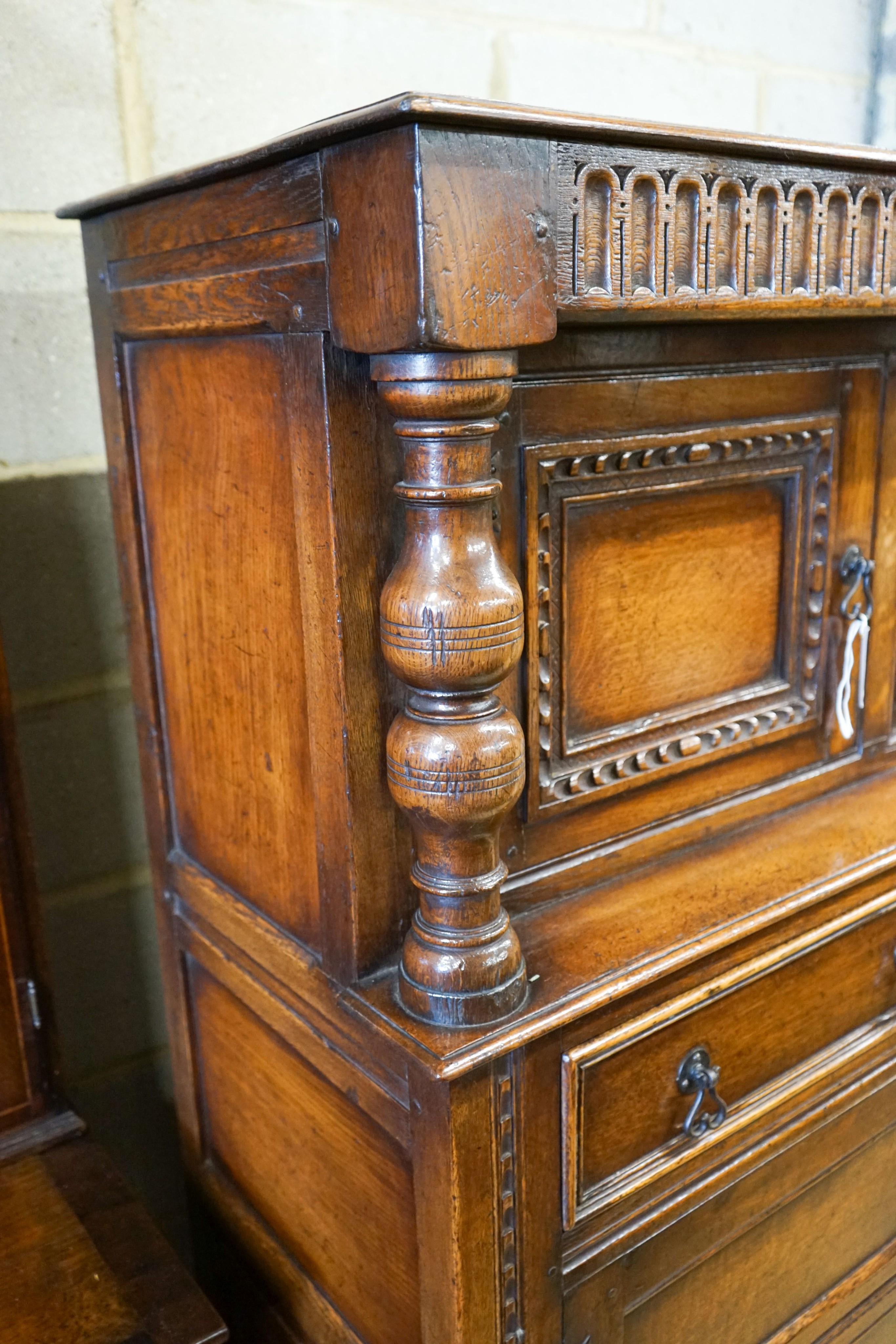 A 17th century style carved and panelled oak court cupboard,on turned supports, length 145cm, - Image 3 of 4