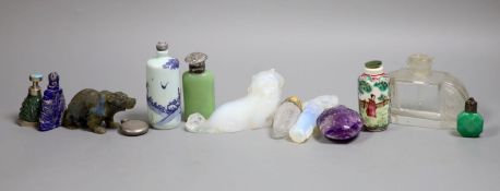 A collection of Chinese snuff bottles and European glass scent bottles, an opalescent glass figure