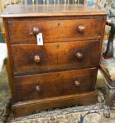 A small Victorian oak three drawer chest, width 61cm, depth 43cm, height 71cm