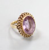 A continental 14k yellow metal and oval cut amethyst set dress ring, size M, gross weight 8.5