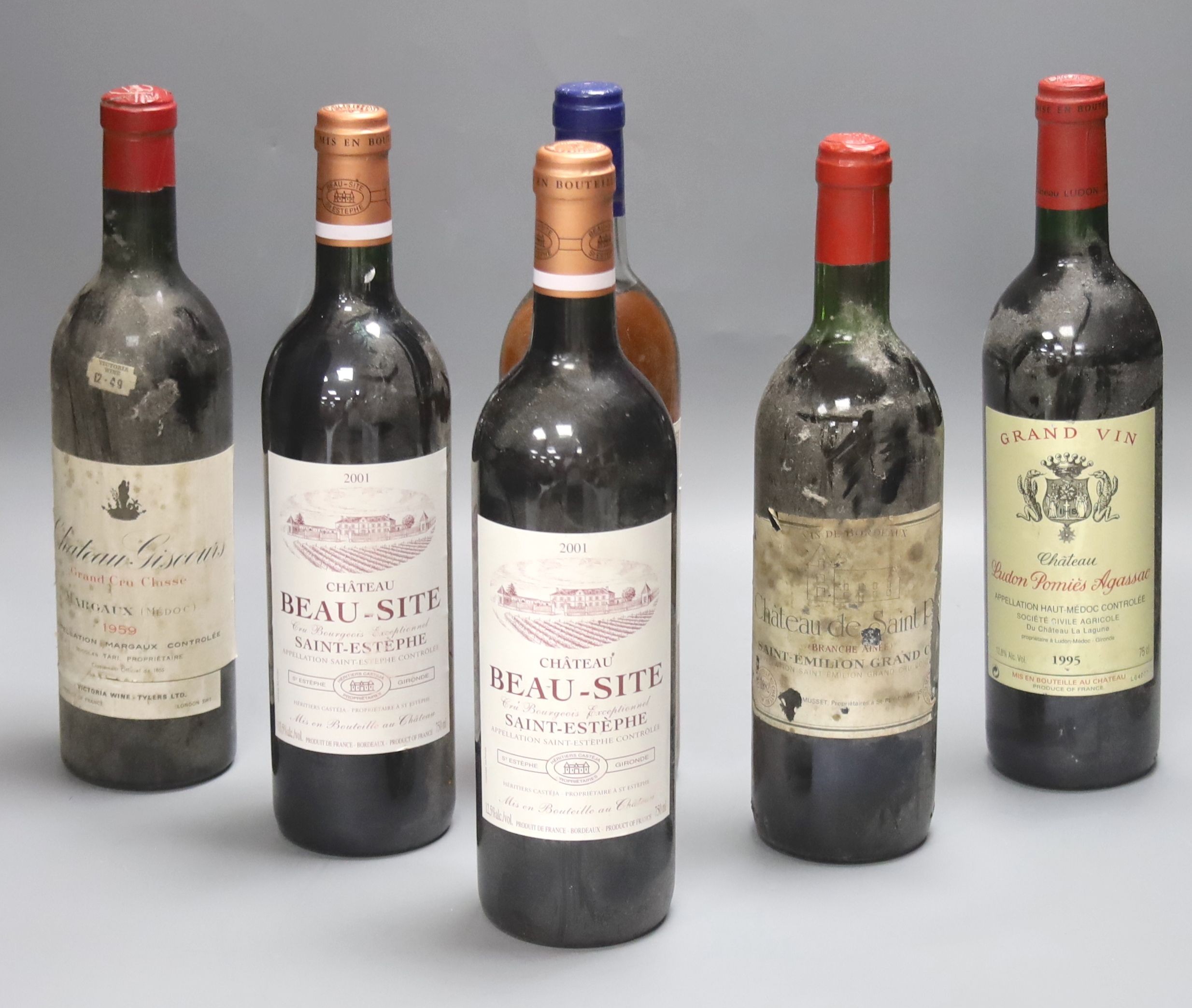 Five red Bordeaux wines including two Chateau Beau Site, Saint Estephe, 2001, one Chateau de Saint