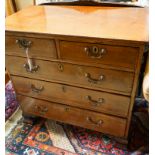 A George III mahogany chest of three long and two short drawers, on carved ogee bracket feet,