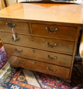 A George III mahogany chest of three long and two short drawers, on carved ogee bracket feet,