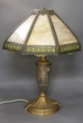 A Louis XVI style gilt shelter table lamp with octagonal slag glass shade