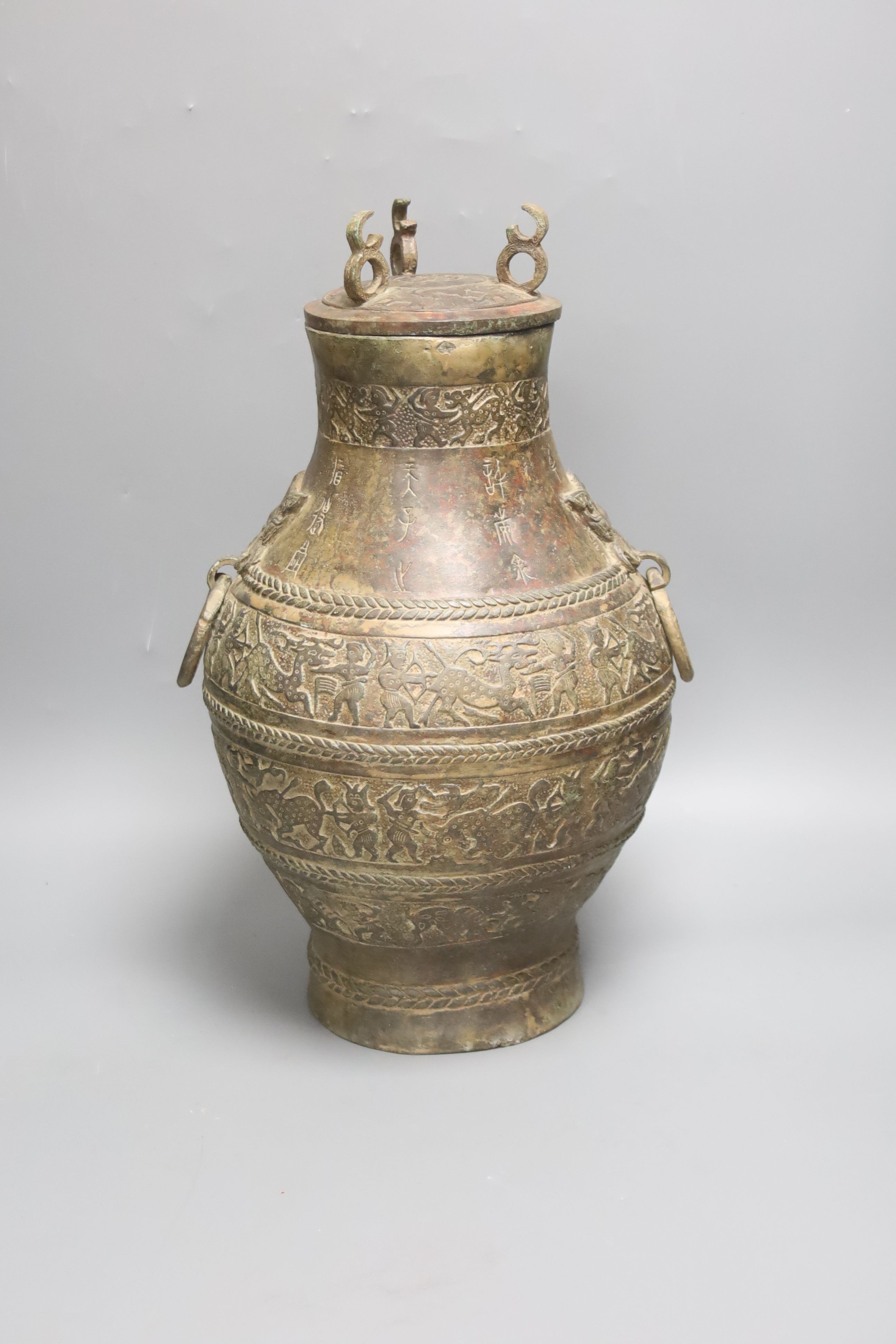 A Chinese cast bronze jar and cover, height 40cm