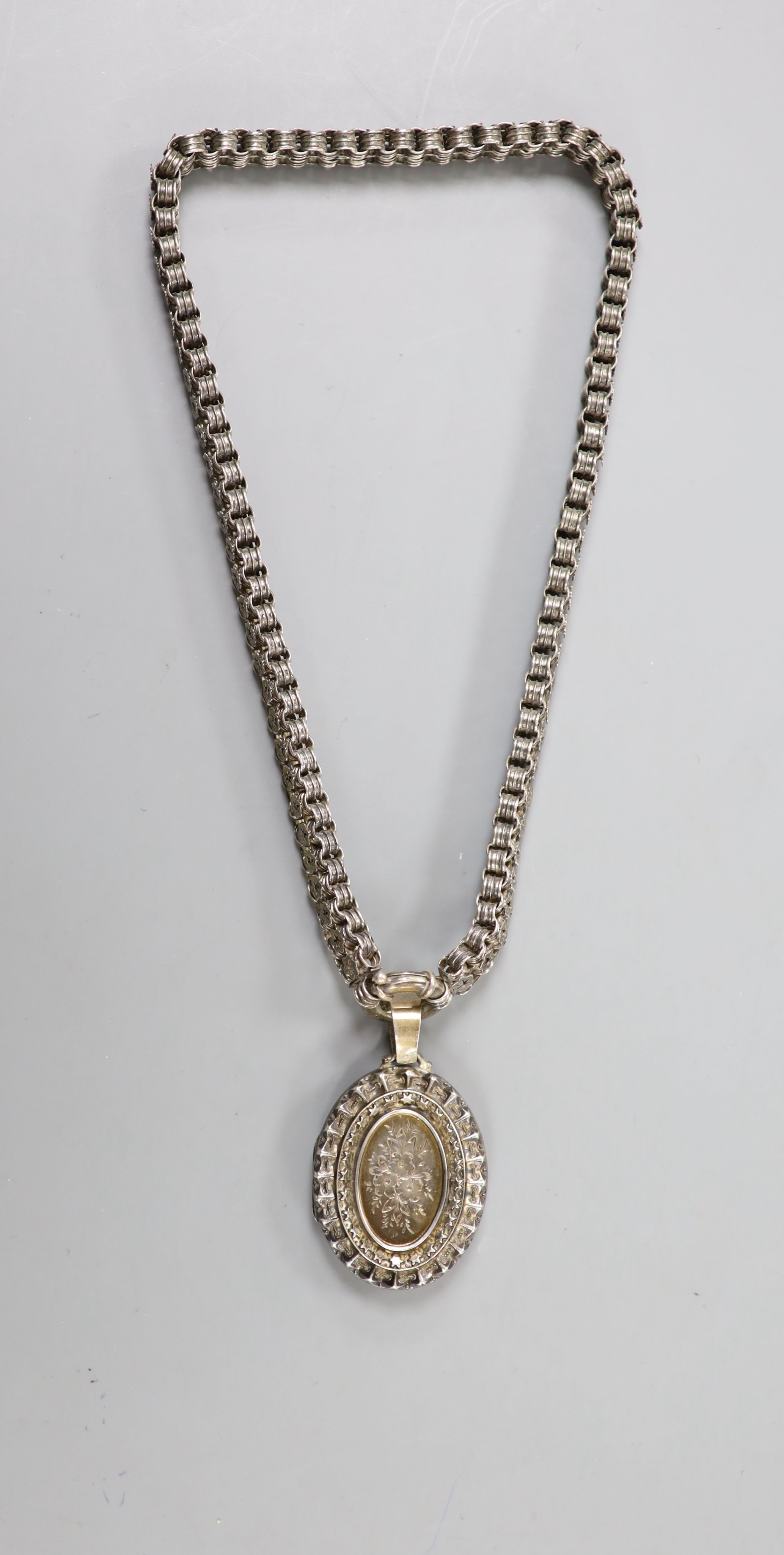 A late Victorian silver oval locket, 45mm, on a pierced white metal chain, 43cm. - Image 4 of 4