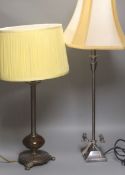 A bronze table lamp with mottled brown glass fitting and a chromed adjustable lampwith two