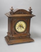 A Late 19th century German walnut mantel clock,with German striking movement34cm