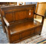 A 1920's rectangular bevelled wall mirror in oak frame, width 53cm, height 74cm together with a late