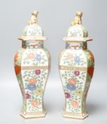 A pair of Samson kakiemon style lidded hexagonal baluster vases41cm