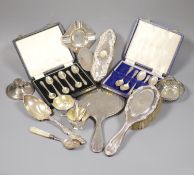 A collection of small silver including condiments, mirror and brushes, astray, cased items and a