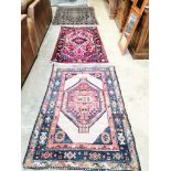 095Two Oriental rugs and another Eastern rug, largest 204 x 140cm