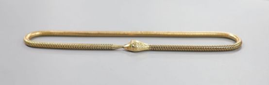 An Edwardian 9ct gold serpentine coil link serpent choker necklace, with green garnet set eyes,