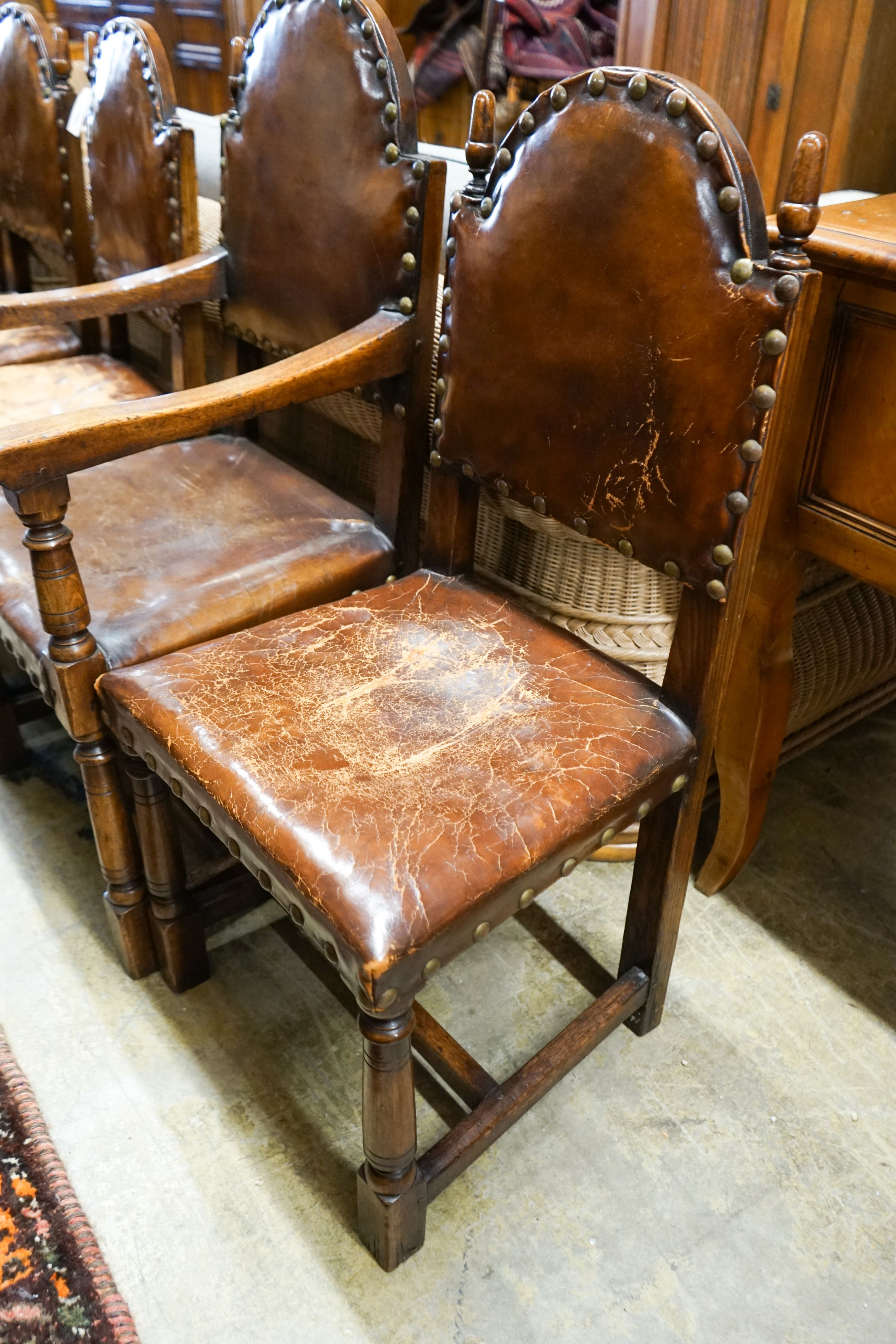A set of six oak dining chairs,having arched backs and brass-studded brown leather upholstery (two - Image 2 of 4