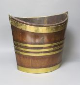 An early 19th century Dutch mahogany and brass bound oyster or peat bucket33cm