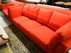 A contemporary Moroso three seater and two seater sofa upholstered in red fabric, the larger