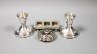 A pair of silver mounted dwarf candlesticks, 71mm, a late Victorian silver three division stamp
