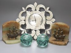 A small Venetian mirrored glass wall clock and a pair of green glass ‘candleholder’ dumps and a pair