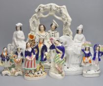 A group of seven Staffordshire pottery flatbacks, tallest 36 cm