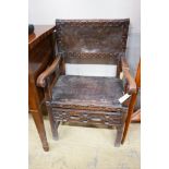 An 18th century oak elbow chair, width 59cm, depth 54cm, height 96cm