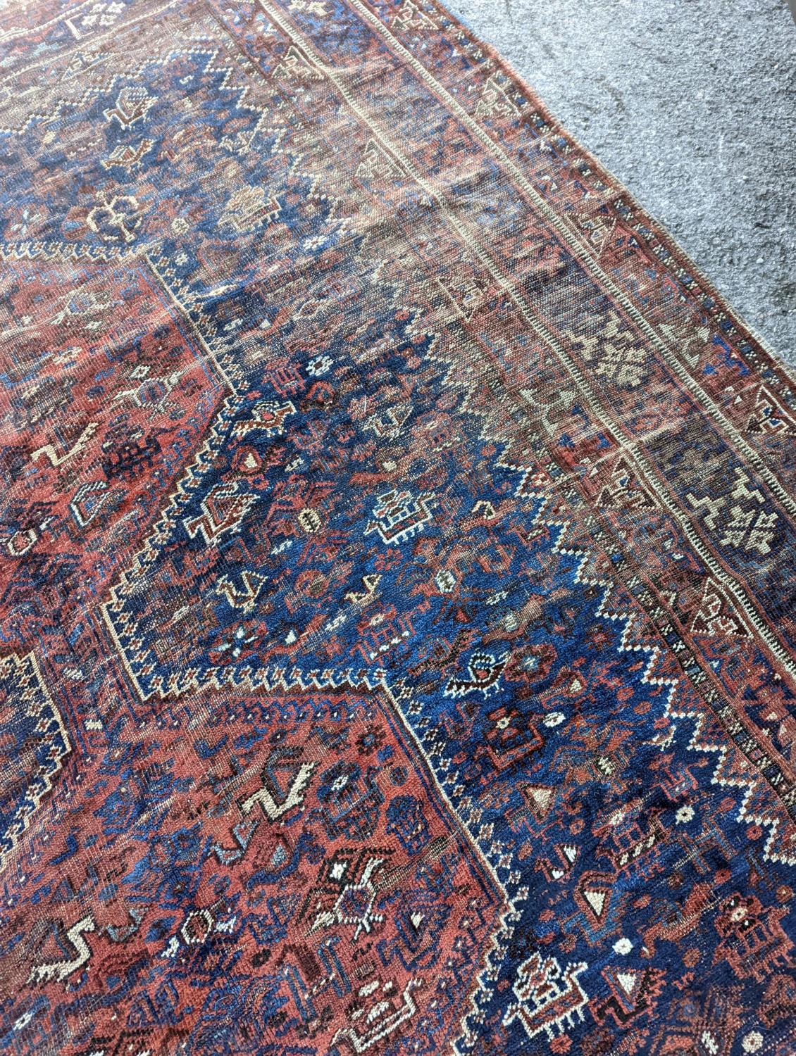 An antique Shirvan red ground carpet (worn), 295 x 207cm - Image 5 of 7