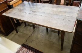 An early 19th century French provincial oak farmhouse table, fitted drawer, length 175cm, depth