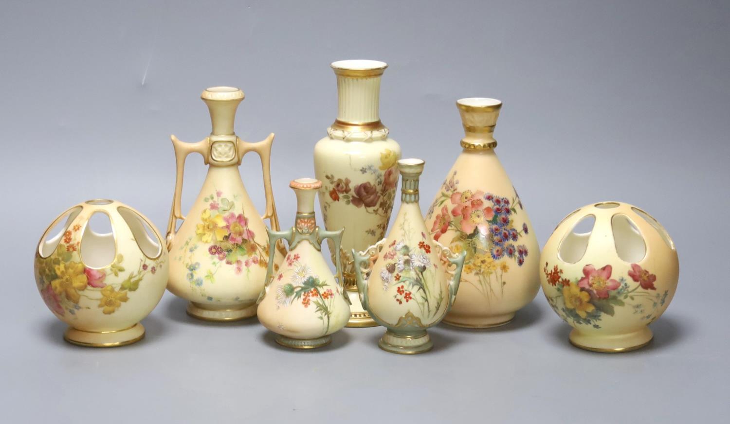 A small group of Royal Worcester blush ivory - a pair of globe pot pourri, a pair small vases and