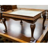 A rectangular oak tray top low table inset with a map of Cheshire on ball and claw stand, width