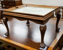 A rectangular oak tray top low table inset with a map of Cheshire on ball and claw stand, width