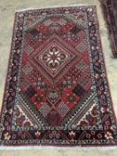 A North West Persian red ground rug