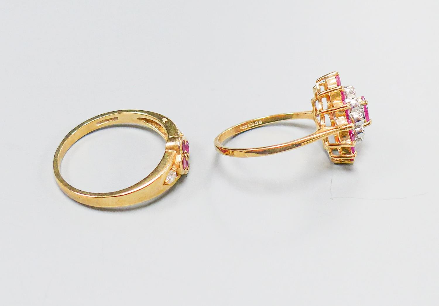 A 9ct yellow gold, ruby and diamond oval cluster ring, size M and another similar 9ct ring, gross - Image 3 of 4