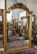 A Victorian giltwood and gesso overmantel mirror with arched scroll pediment, width 112cm, height