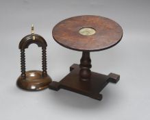 A 19th century oak miniature tilt top table with naval portrait, 23.5cm high tilted up, and a lignum