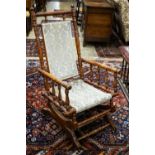 An early 20th century American rocking chair, width 54cm, depth 50cm, height 106cm