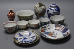 A group of Chinese enamelled porcelain vases and bowls, a similar blue-and-white jar and cover, 18th