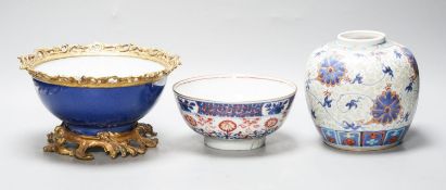 An 18th century Chinese clobbered blue and white bowl, a Samson powder blue ormolu mounted bowl,
