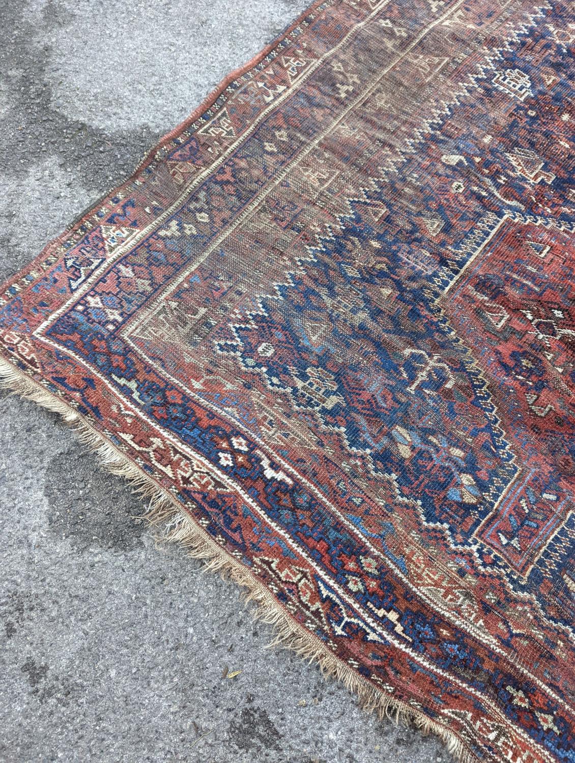 An antique Shirvan red ground carpet (worn), 295 x 207cm - Image 3 of 7