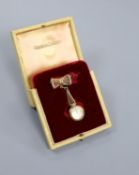 A lady's 9ct gold Jaeger LeCoultre manual back wind pendant watch on a 9ct gold suspension brooch,