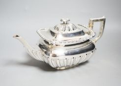 An Edwardian demi-fluted silver teapot, Sheffield, 1901, gross 22.5oz.
