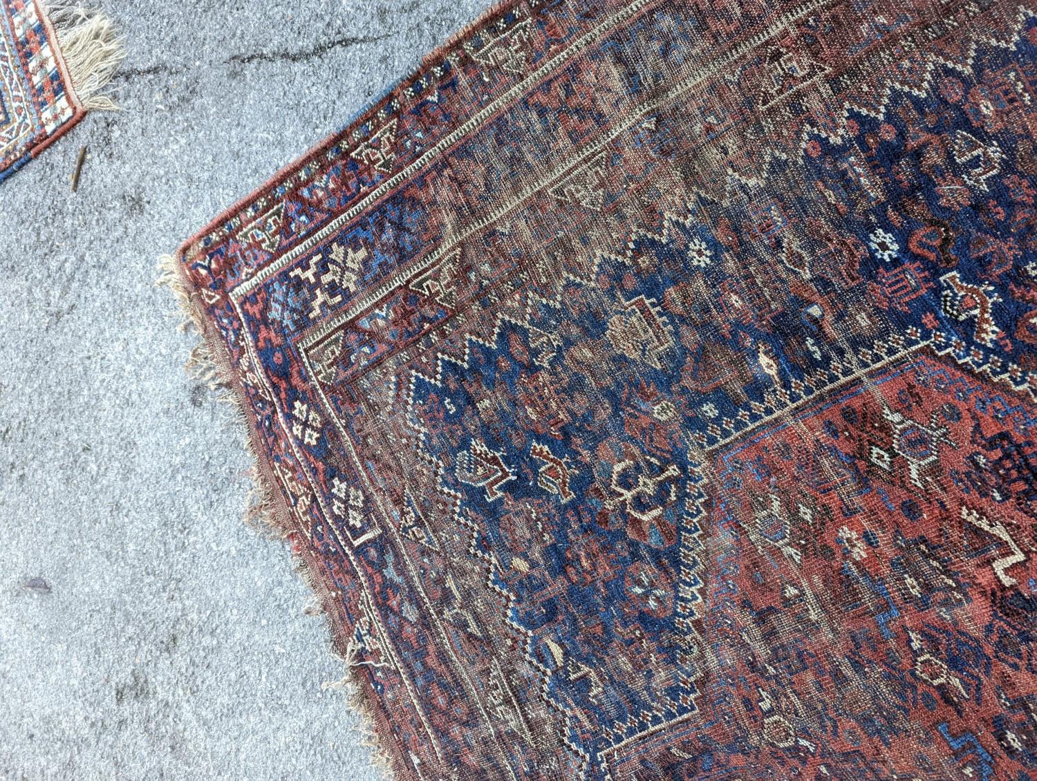 An antique Shirvan red ground carpet (worn), 295 x 207cm - Image 7 of 7