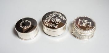 Three assorted early 20th century silver and tortoiseshell pique circular boxes and covers, two by