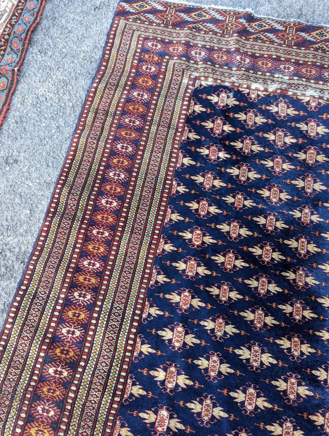 A Bokhara blue ground rug, 191 x 126cm - Image 4 of 6
