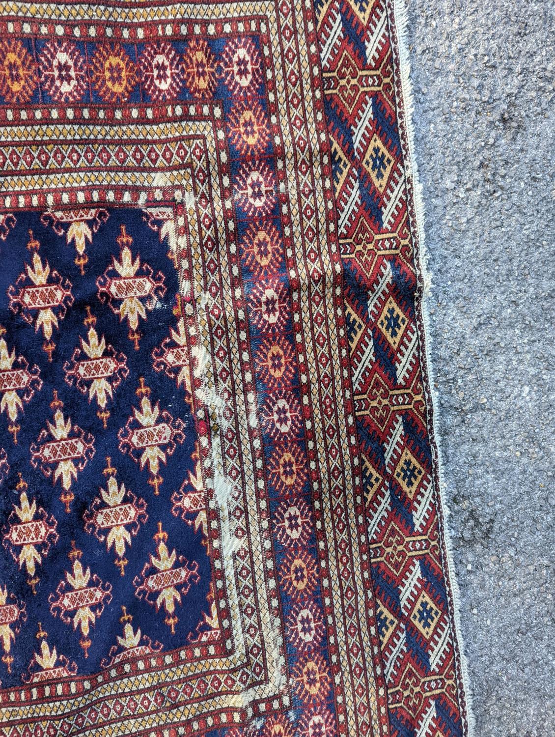 A Bokhara blue ground rug, 191 x 126cm - Image 6 of 6